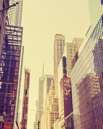 Vintage stylized photo of skyscrapers in Manhattan, New York City, USA.の写真素材