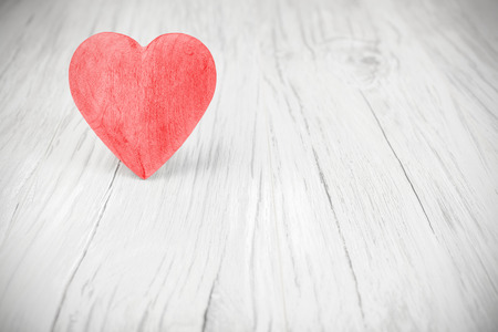 Wooden red heart on white background, space for text.の写真素材