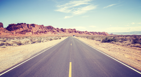 Vintage toned photo of an endless road.の写真素材