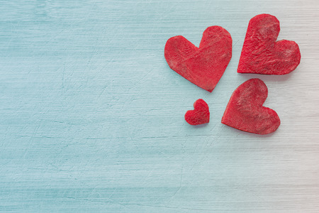 Retro stylized hearts made of beet on wooden background, space for text.の写真素材