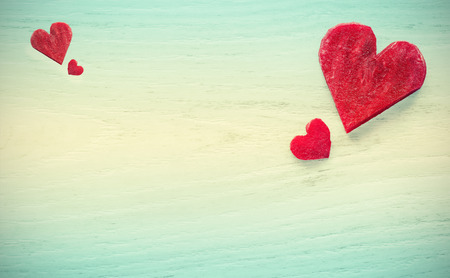 Retro stylized hearts made of beet on wooden background, space for text.の写真素材