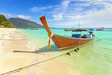 Long tail boat at a beautiful beach, Thailand.の写真素材