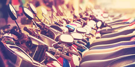 Vintage stylized picture of scooters in a row.の写真素材