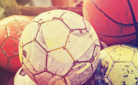 Vintage old film stylized used balls in a basket, shallow depth of field.の写真素材