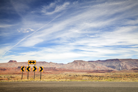 Retro toned photo of road signs, choice concept, space for text.の写真素材