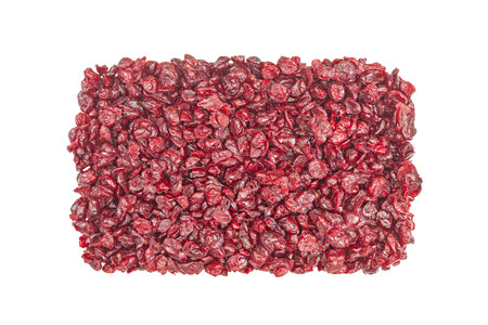 Cut cranberries isolated on white, food background.