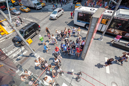 New York, USA - August 17, 2015: Wide angle picture of people on the Times Square, called by many as...