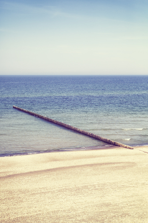 Vintage toned picture of a tranquil sea and beach, nature background.の写真素材