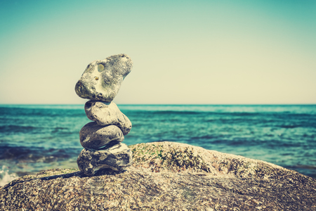 Vintage stylized stack of stones, shallow depth of field.の写真素材