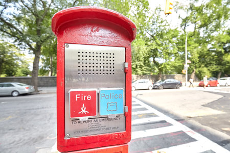 New York, USA - August 18, 2015: Police and Fire emergency call box located by the Central Park in...