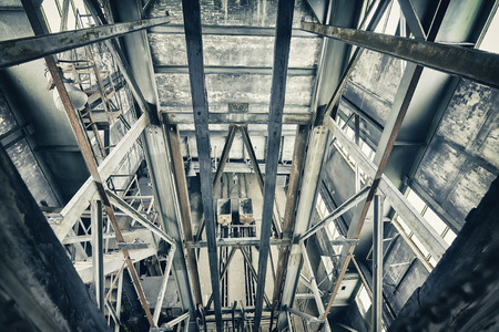 Vintage toned abandoned industrial interior, lapse of time and deterioration concept.の写真素材