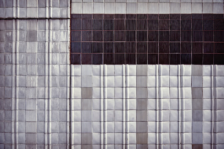 Vintage toned old ceramic tile wall, abstract background.の写真素材