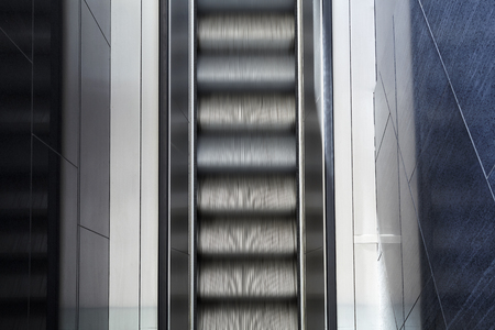 Top view of motion blurred empty escalator, abstract modern background.