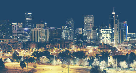Retro toned Denver downtown skyline at night, Colorado, USA.の写真素材