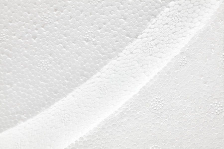 Shaped white polystyrene foam, selective focus, styrofoam texture background.の写真素材