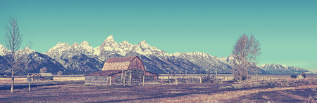 Retro stylized famous Grand Teton panoramic view, Wyoming, USA. の写真素材