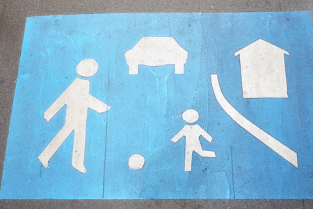 Built up area blue street sign painted on an asphalt street.の写真素材