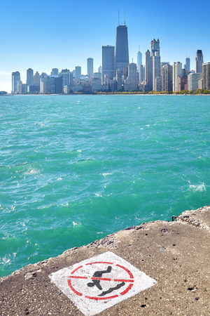 Chicago skyline with no diving sign on foreground, focus on the city. の写真素材