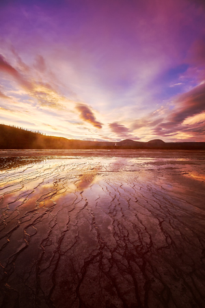Picturesque pink sunset at Grand Prismatic Spring in Yellowstone National Park, Wyoming, USA.の写真素材