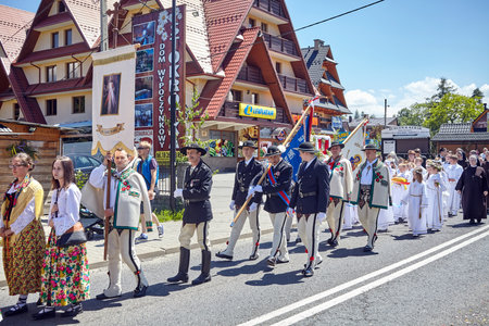 Bialka Tatrzanska, Poland - June 15, 2017: Corpus Christi religious procession through a main street of Bialka Tatrzanska, mountainous village close to the border with Slovakia.のeditorial素材