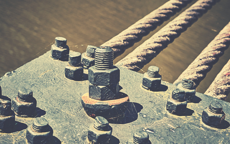 Close up of a bridge construction details, industrial background, color toning applied.