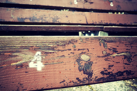 Number four painted on an old wooden seat, conceptual picture with copy space on the right.の写真素材