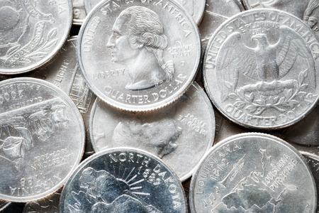 Extreme close up picture of United States quarter dollar coins, shallow depth of field.の写真素材