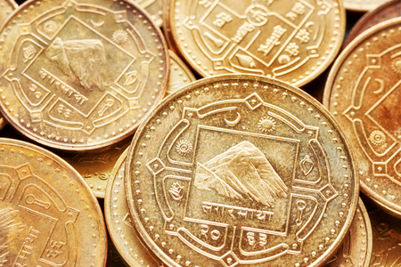 Close up picture of Nepalese rupee coins, shallow depth of field.の写真素材
