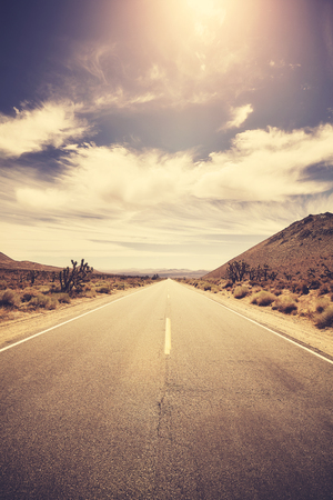 Vintage stylized picture of a road at sunset, travel concept, USA.の写真素材