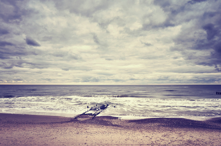 Color toned picture of an empty beach, nature background.の写真素材