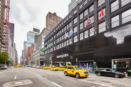 New York, USA - May 26, 2017: Yellow cabs parked in front of the Bloomingdale's department store, owned by Macy's, Inc.のeditorial素材