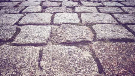 Cobblestone path in a park, close up color toned picture, shallow depth of field.の写真素材