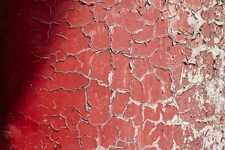 Cracking and peeling paint on a wall, background or texture, selective focus.の写真素材