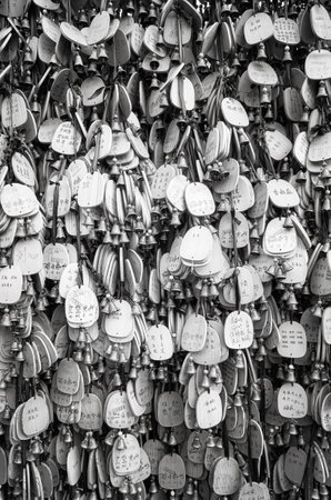 Lijiang, China - September 22, 2017: Prayers and wishes on wooden plates hanged in a temple by the...