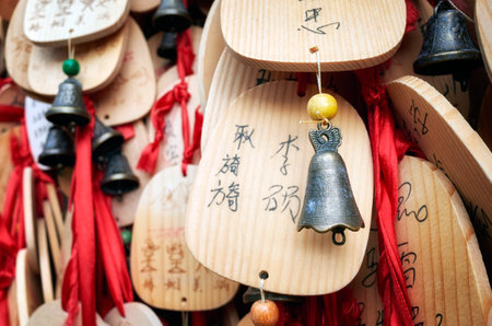 Lijiang, China - September 22, 2017: Prayers and wishes on wooden plates hanged in a temple by the White Water River in Blue Moon Valley.のeditorial素材