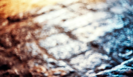 Blurred picture of a cobblestone street, abstract background.の写真素材