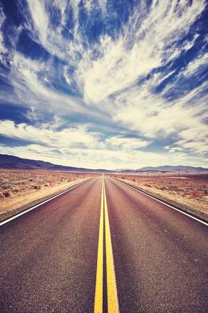 Endless desert road in the Death Valley, color toned picture, California, USA.の写真素材