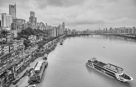 Chongqing, China - October 03, 2017: Cruise ship leaves harbor. The city of Yangtze basin.