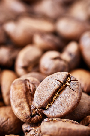 Close up picture of freshly roasted coffee beans, shallow depth of field.の写真素材
