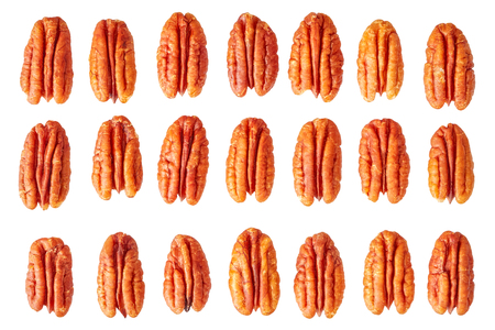 Dried pecan nut halves isolated on white background.の写真素材
