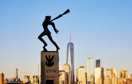 Jersey City, USA - June 30, 2018: Katyn Memorial, created by Andrzej Pitynski at sunset. Statue is dedicated to the victims of the Katyn massacre in 1940.のeditorial素材
