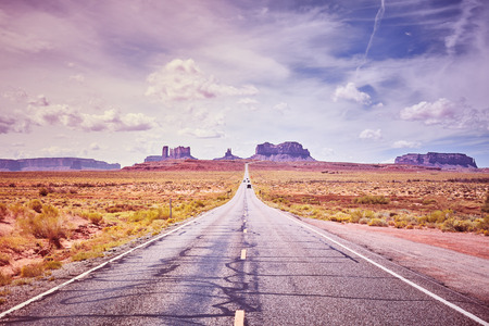 Scenic road to Monument Valley, color toned picture, USA.の写真素材