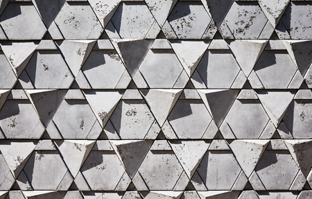 Triangular shape bricks wall background or texture.