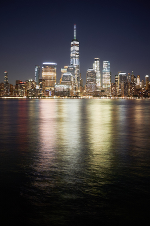 Manhattan skyline reflected in Hudson River at night, New York City, USA.の写真素材
