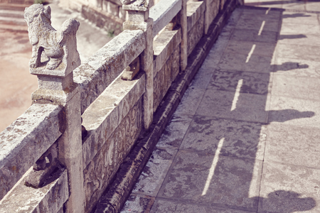 Details of a stone path in an ancient Buddhist temple, color toning applied, selective focus, Kunming, China.の写真素材