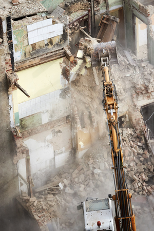 Building demolition with an excavator, view from above.の写真素材