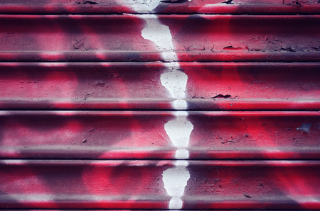 Old painted grunge corrugated wall background, color toning applied.の写真素材