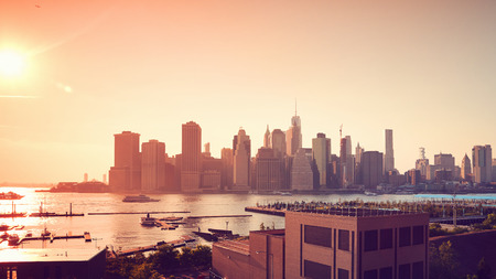 Manhattan at sunset, color toning applied, New York, USA.の写真素材