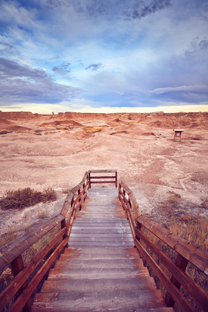 Color toned picture of wooden stairs to a trail in Badlands National Park, South Dakota, USA.の写真素材