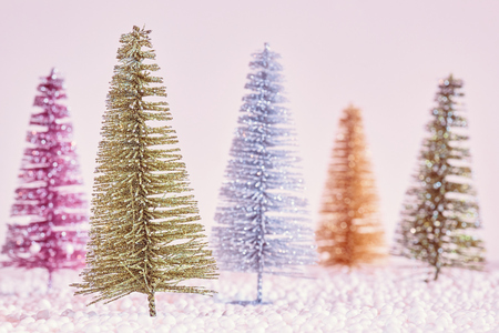 Retro stylized picture of miniature Christmas trees, selective focus.の写真素材